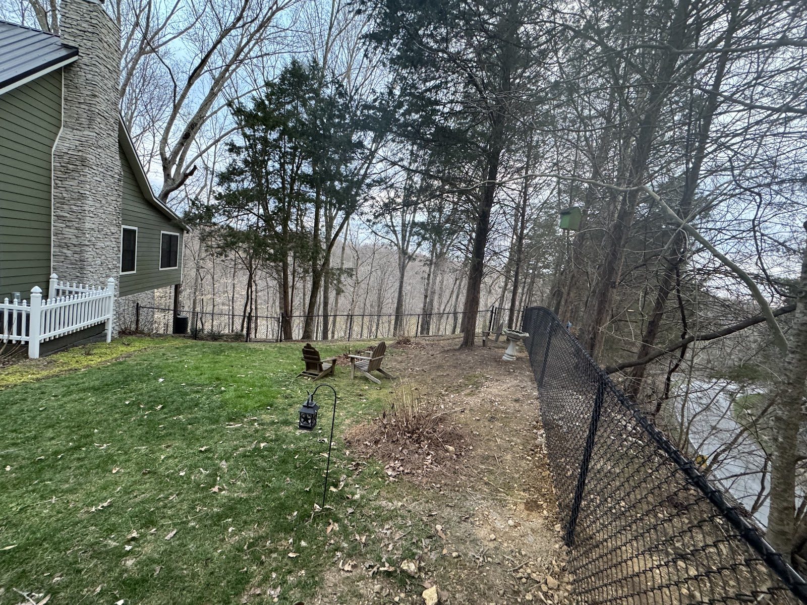 Black chain link fence around a yard