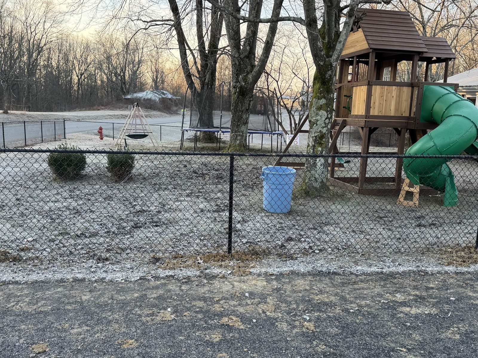 Black chain link fence around a play yard